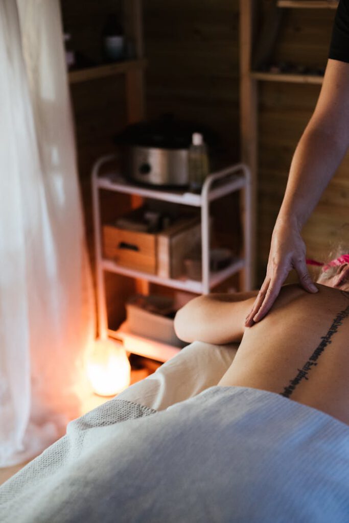 A tranquil spa session showcasing a relaxing back massage in a cozy indoor setting.